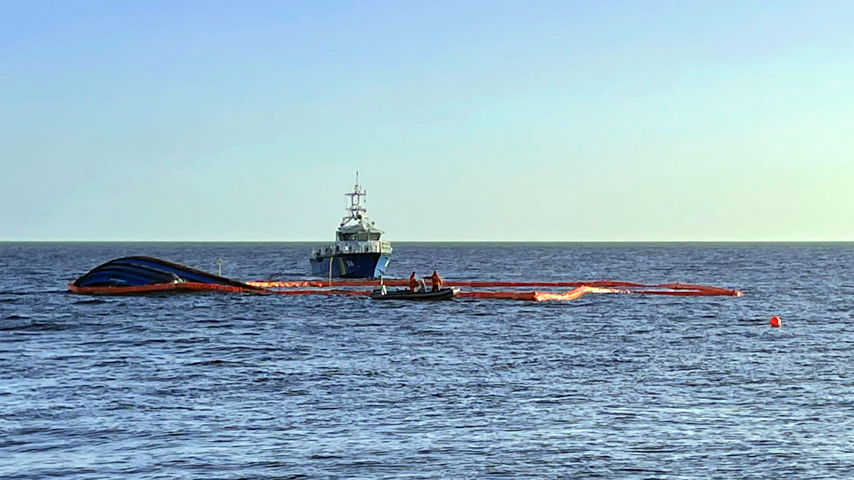 Operation Karin Hoej the ship with booms around the hull KBV 314 in the background 211216